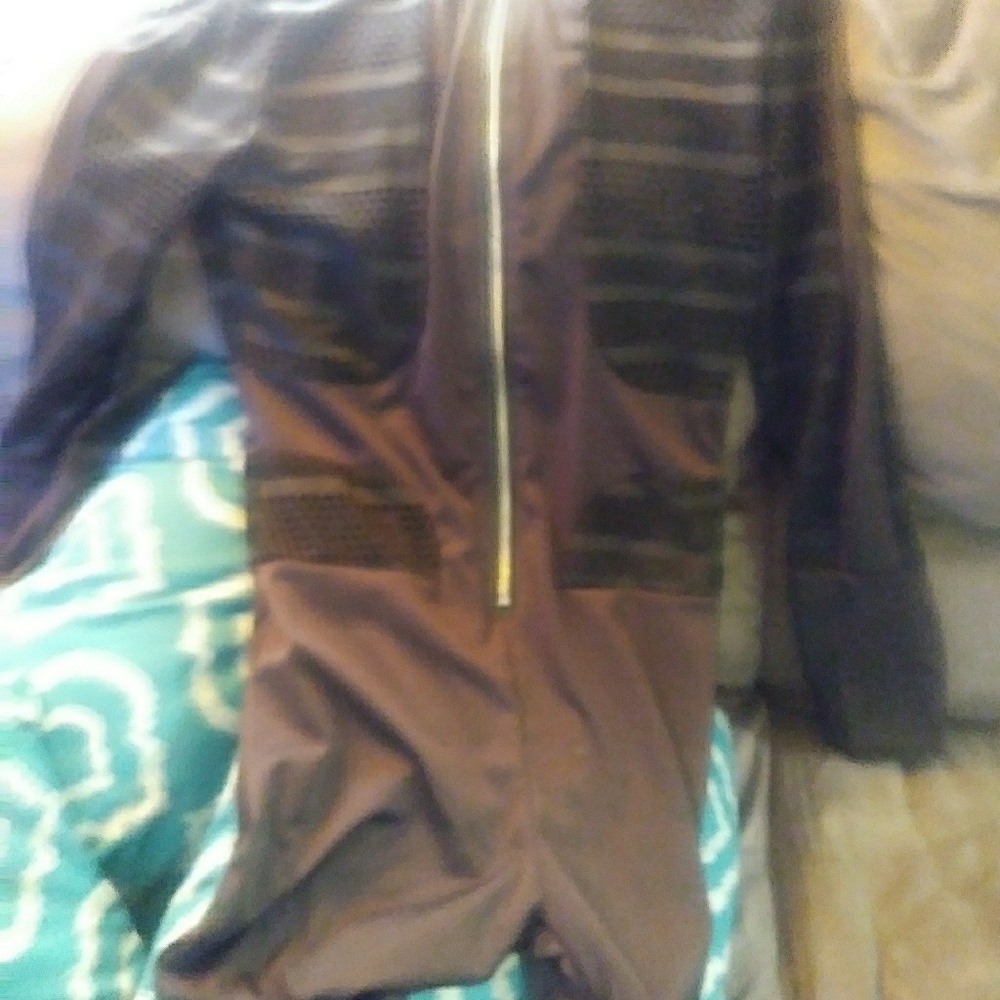 Its a jump suit..the color is black
